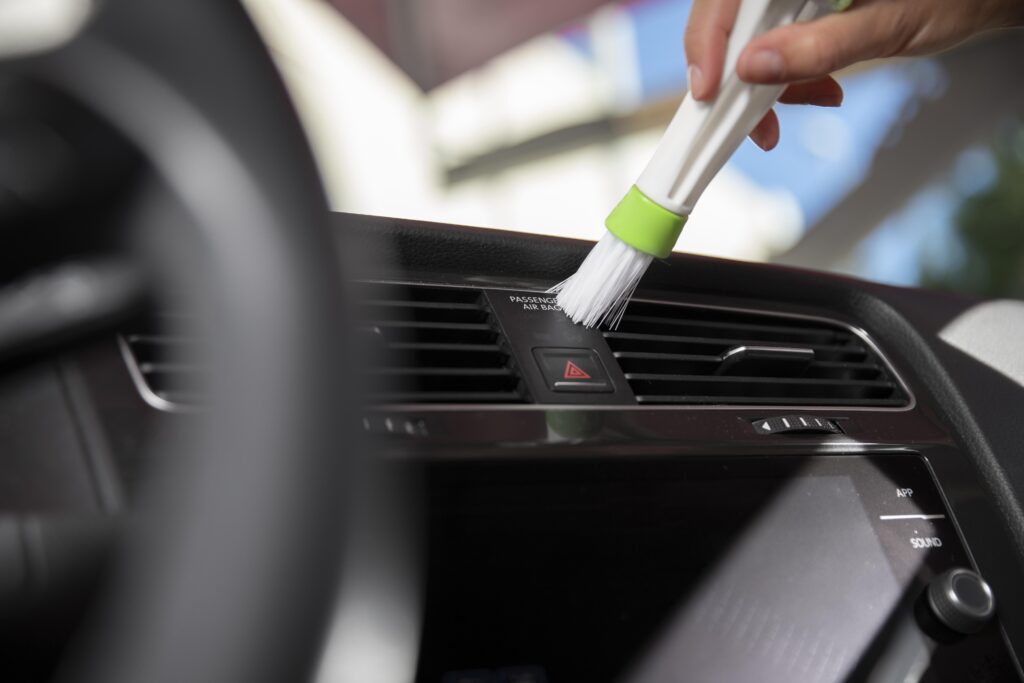 close-up-car-care-dusting car detailing